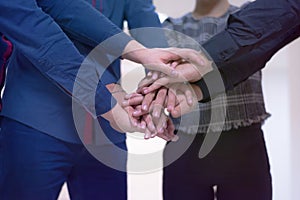 Young business people, Teamwork Stacking Hand Concept. Close up of young people putting their hands together. Business people with