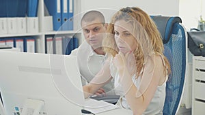 Young business people using computer in the office.