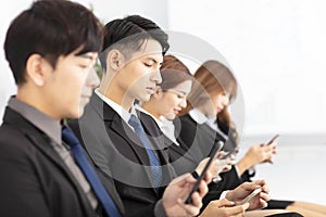 Young business people using the smart phone