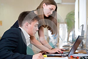 Young business people work in a computer class