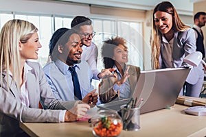 Young business people working together in creative office. Selective focus