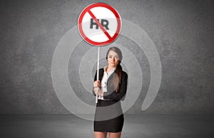 Young business person holdig traffic sign