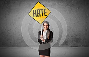 Young business person holding road sign