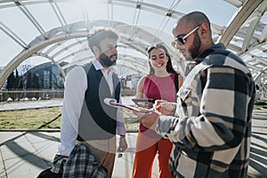 Young business professionals engaging in outdoor discussion in an urban setting