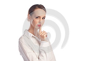 Young business style woman with silence gesture