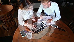 Young business team agree, resolve issues, press keyboard laptop