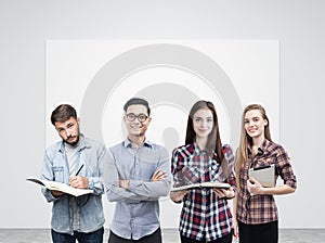 Young business team and blank poster