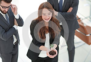 Young business team with fresh sprouts