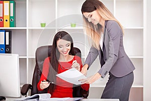 Young business team reading sticky notes on the work desk in off