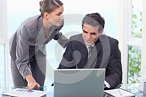 Young business team working with a laptop