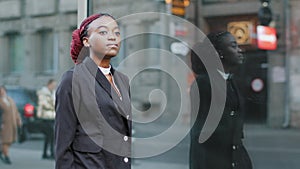 Young business woman african american girl lady walking near building of company office being late for interview meeting