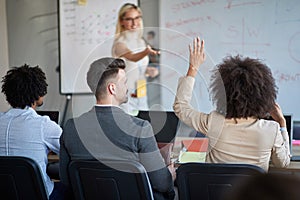 Young business woman ask a question at the meeting