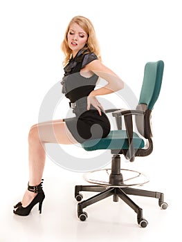 Young business woman with backache back pain.