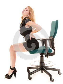 Young business woman with backache back pain.