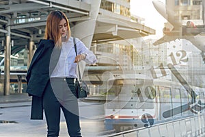 Young business woman checking the time