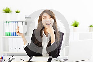 young business woman drinking coffee in office