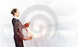 Young business woman with a drum