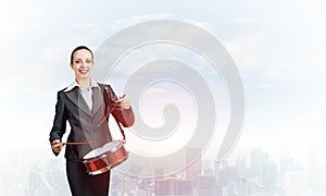 Young business woman with a drum