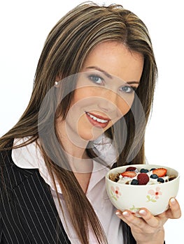 Young Business Woman Eating a Bowl of Cereals with Yogurt and Be