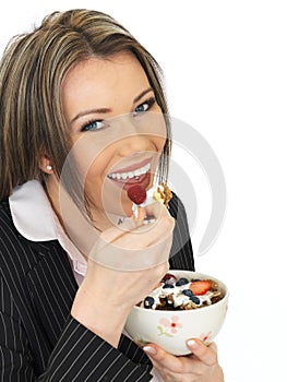 Young Business Woman Eating a Bowl of Cereals with Yogurt and Be