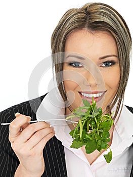 Young Business Woman Eating a Fresh Green Leaf Salad