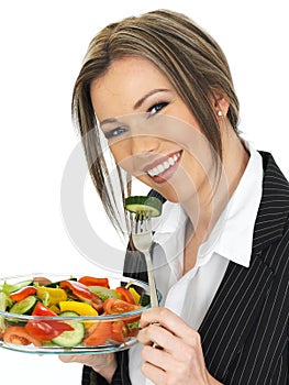 Young Business Woman Eating a Fresh Mixed Salad