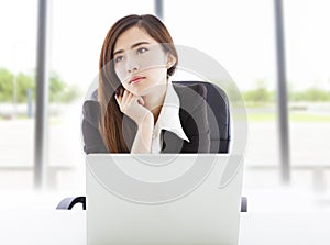 Young business woman feel unhappy in the office