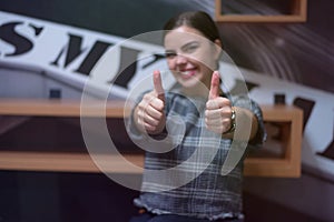 Young business woman with finger up showing business project like woman as leader