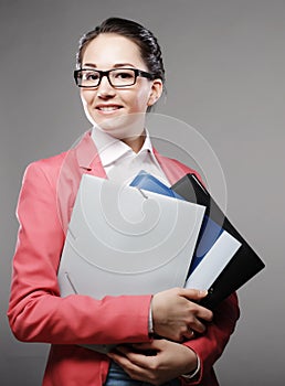 Young business woman with folders