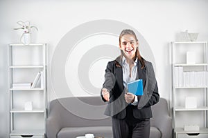 Young business woman freelancer or ceo employee giving hand. Secretary welcome handshake, greeting interview