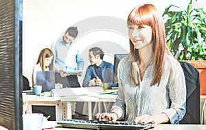 Young business woman having fun working at computer with coworkers at office meeting - Modern start up concept of engagement conn