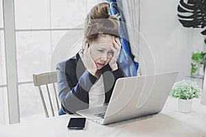 Young business woman having a lot hard work