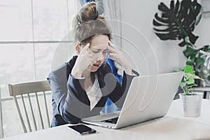Young business woman having a lot hard work