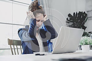 Young business woman having a lot hard work