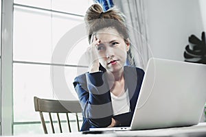 Young business woman having a lot hard work