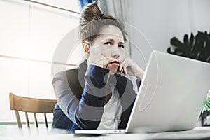 Young business woman having a lot hard work