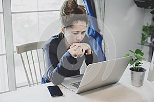 Young business woman having a lot hard work