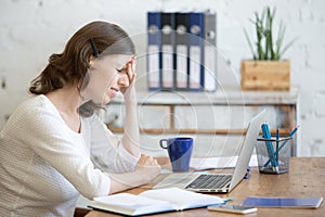 Young business woman with headache