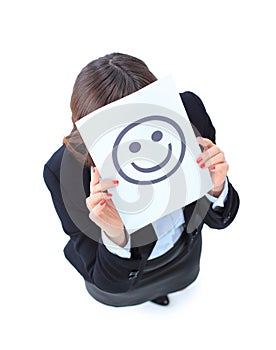 young business woman hiding behind a smiley face