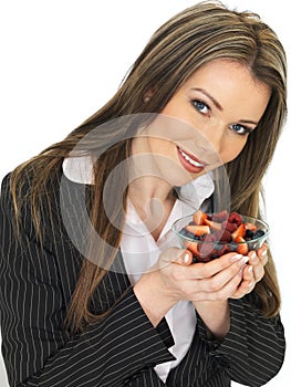 Young Business Woman Holding a Bowl of Fresh Mixed Berries