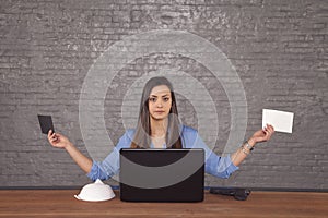 Young business woman is holding two envelopes in her hands