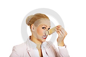 Young business woman with huge clothespin on her nose. Stinks concept