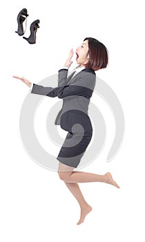 Young Business woman jump and throw shoes