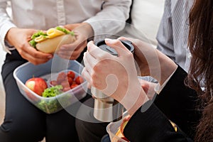 Young business woman with lunch box