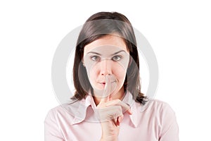 Young business woman making silence gesture isolated over white.