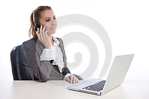 Young business woman at office calling by telephon