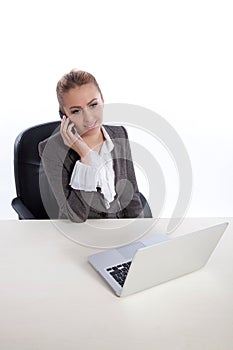 Young business woman at office calling by telephon