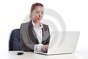 Young business woman at office with laptop