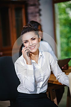 Young business woman in the office at the negotiations