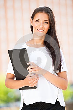 Young business woman outdoors on a summer day